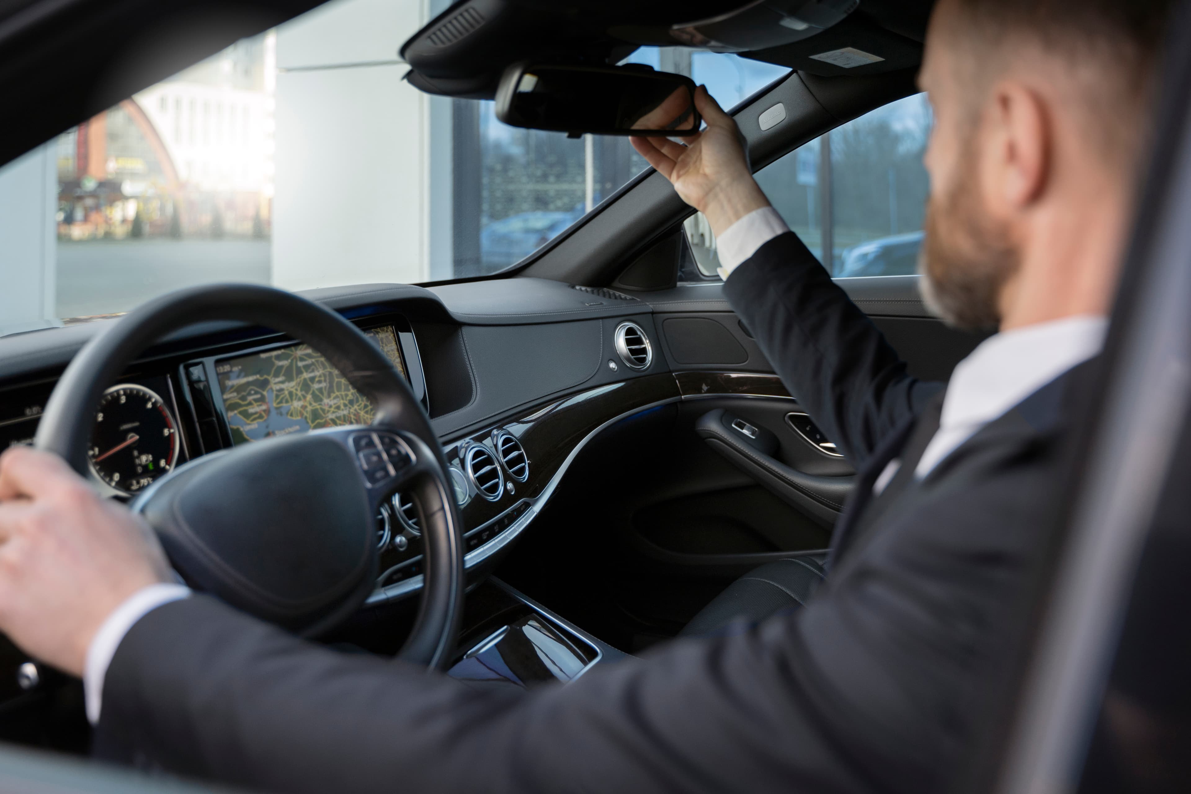 White Line chauffeur in vehicle